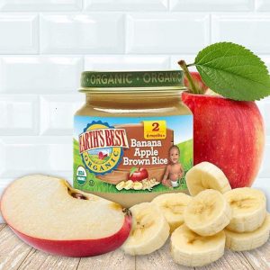 A bottle of Earth`s Best Organic Baby Food with sliced apple and banana