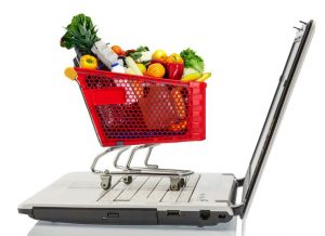 shopping cart full of produce on a laptop