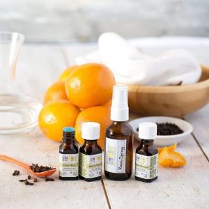 Citrus and Aura Caciia Essential Oils Battles on a Wooden Surface