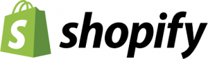 The Shopify logo. On the left, a green shopping bag with a white dollar sign on the bag. On the right, the word Shopify in black.