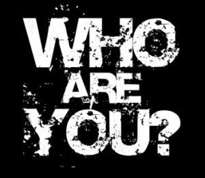 The question, "who are you", written on a dark background, suggesting a lack of branding.