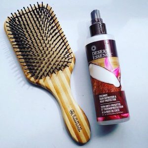 Instagram post @desert_essence of heat protector spray and brush