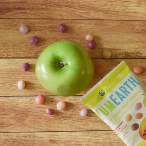 YumEarth organic sour beans with an apple