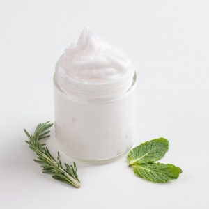 jar of homemade vapor rub with herbs