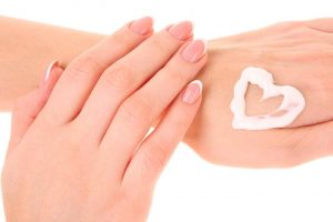 lotion in the shape of a heart on hands