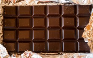 A large milk chocolate bar divided into squares. Premium chocolate's an increasingly popular offering to sell. But, make sure the chocolate you pick is non GMO candy.
