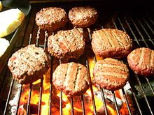 grilling hamburgers on the grill in the summer