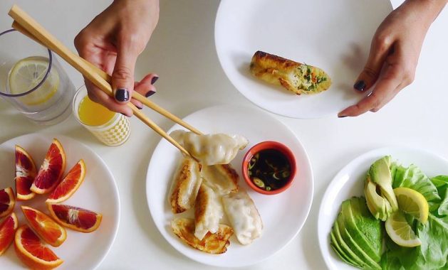 egg roll and potstickers with fruits and veggies
