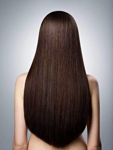woman facing away from camera with really long, straight hair
