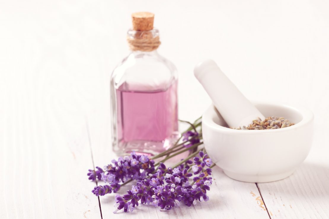 Lavender oil and lavender flowers used for aromatherapy