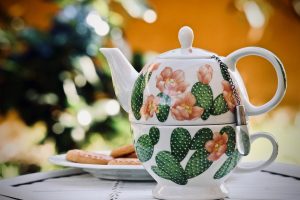 A teapot with cactus print