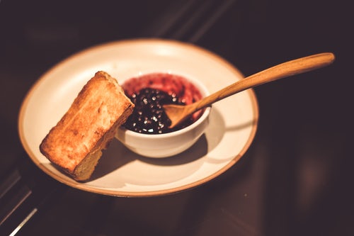 A bowl of blueberry jam.