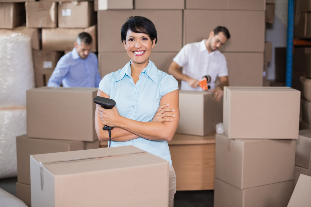 a warehouse worker packing a box. Choose the right vegan dropshipping supplier