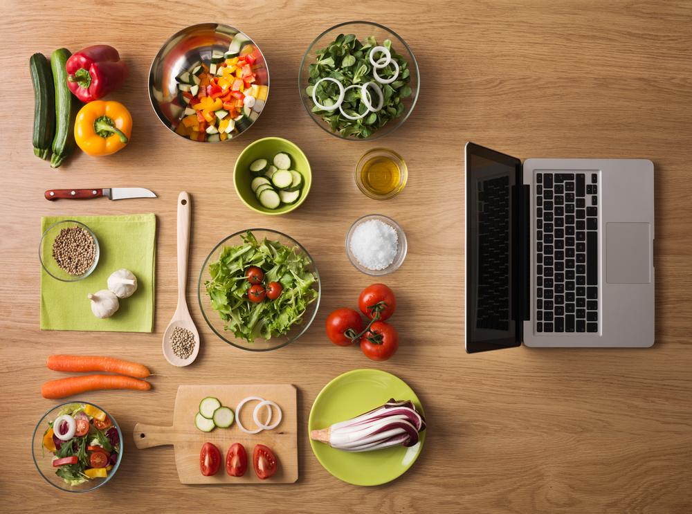 vegetables next to a laptop. what wholesale vegan food should I carry in my online store?