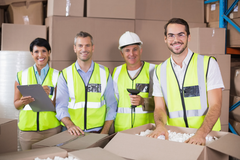 Dropshipping warehouse workers packing boxes. Find a homeopathic medicine supplier.