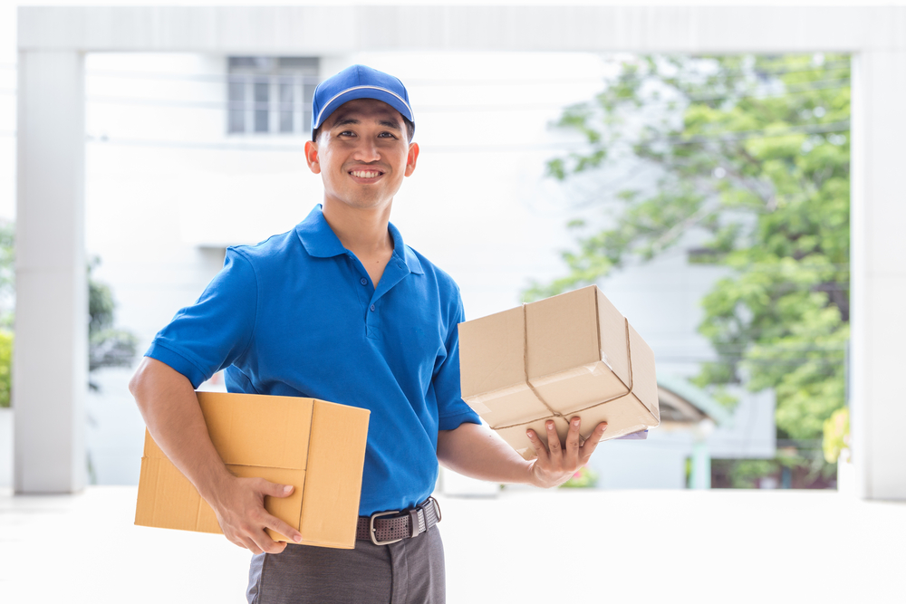 Dropship vitamins. a delivery man bringing a package to a house.