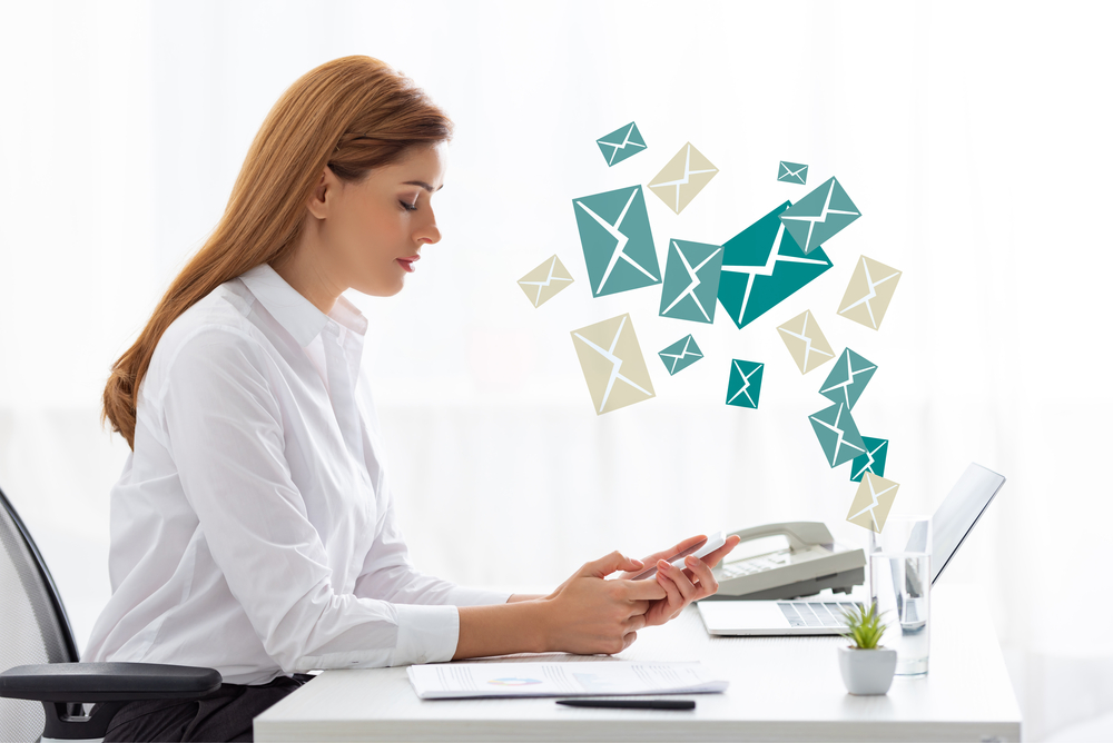 Email marketing for dropshipping: woman at laptop receiving emails