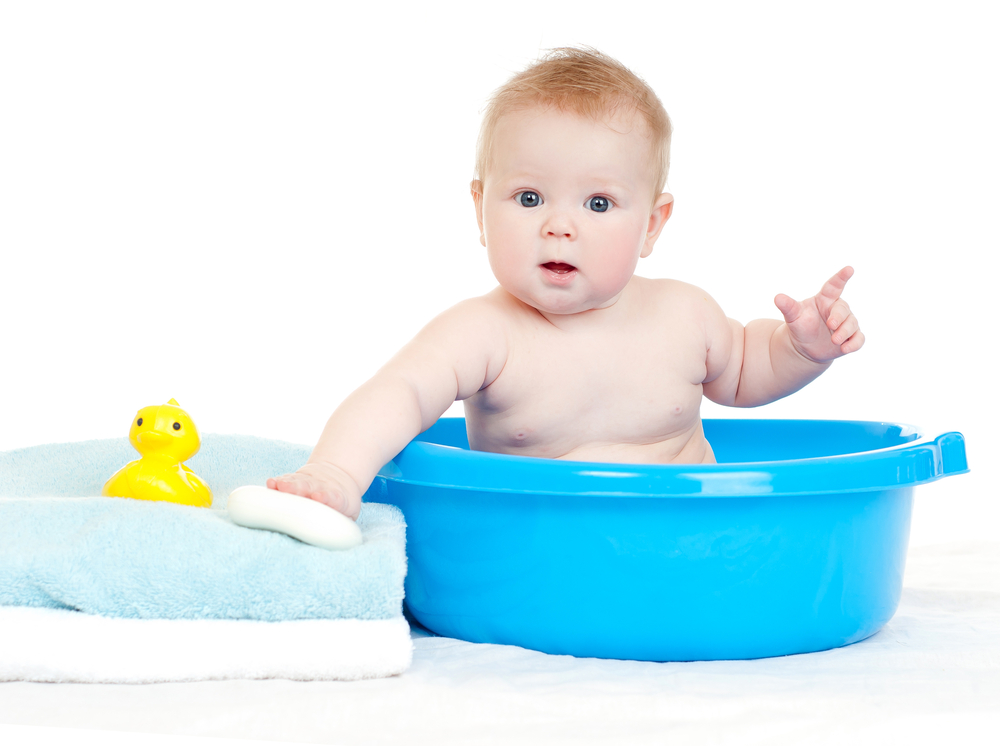 Organic baby products for dropshipping. Cute baby in a bathtub with towels.