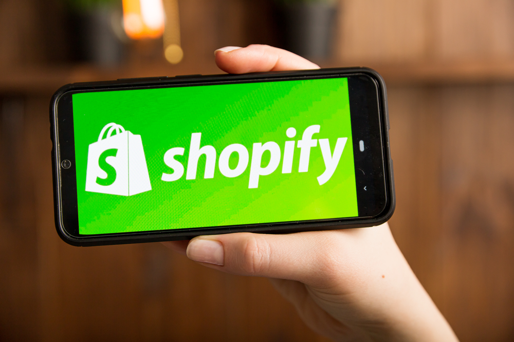 Shopify trending products: looking at the Shopify app on a mobile phone