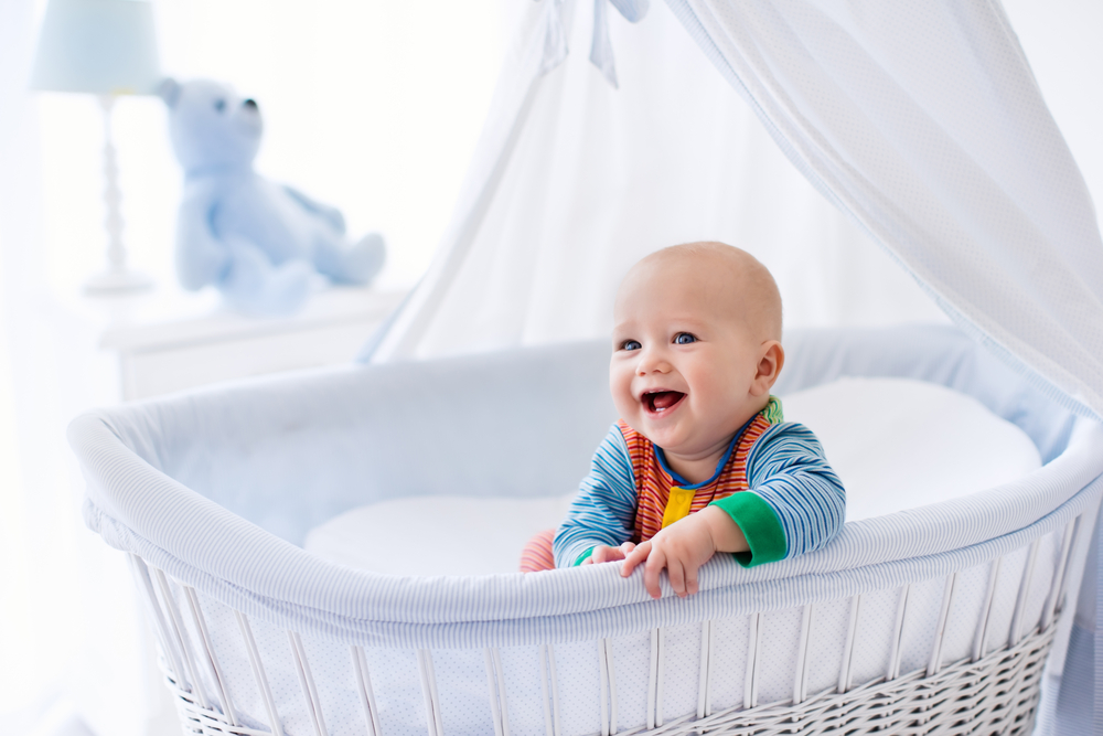 baby in a crib with bedding