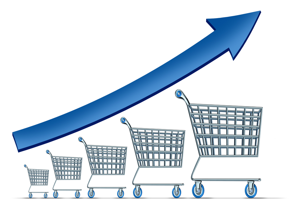 an arrow going up over shopping carts to illustrate increasing your average order value.