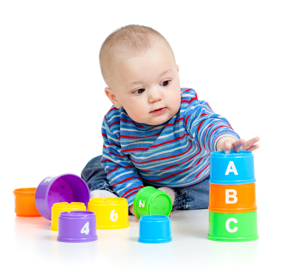 Baby plying with colorful toys