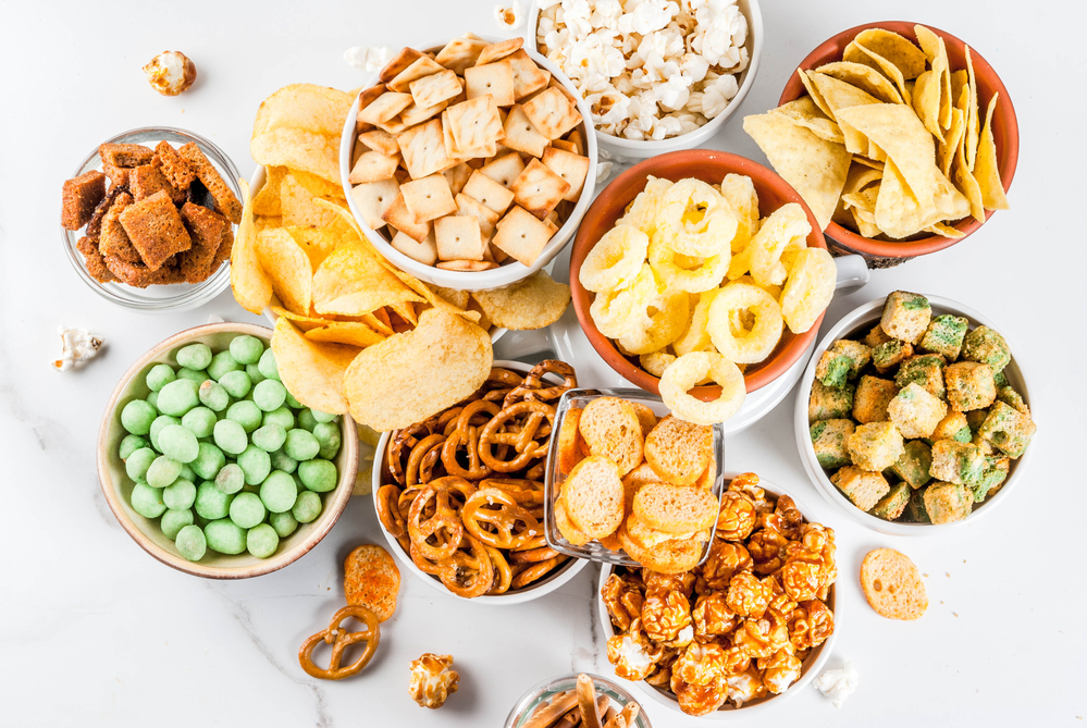 Image of a variety of wholesale snacks in bowls on a counter