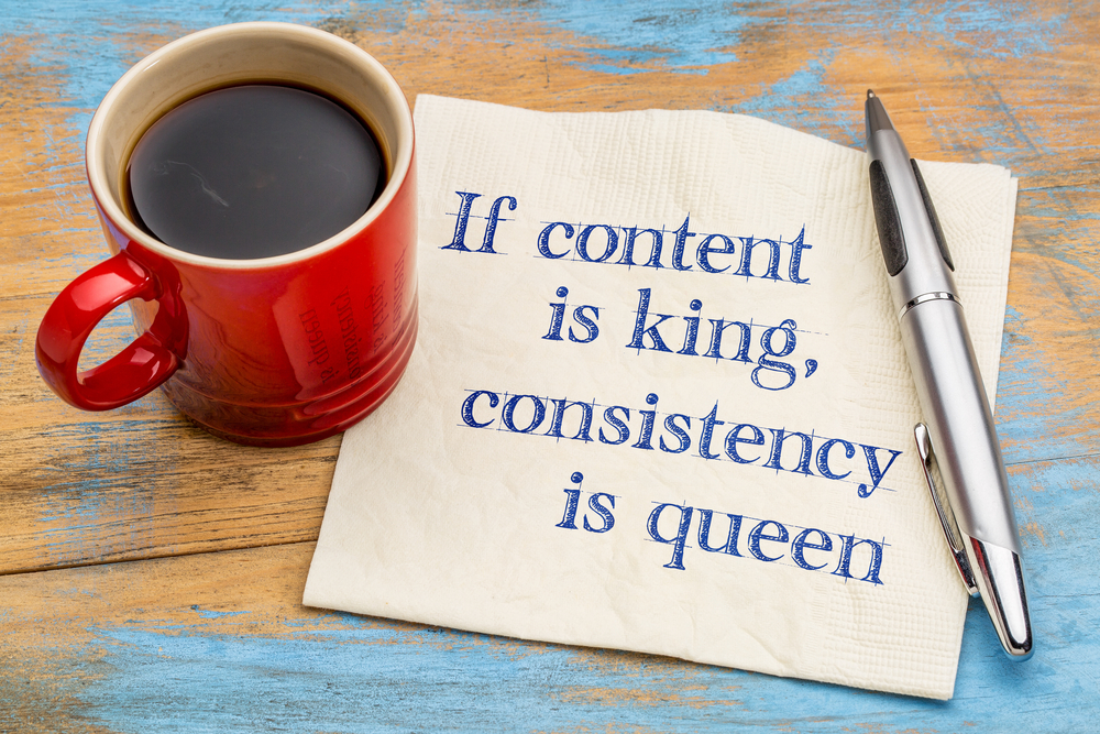 a napkin with the phrase if content is king, consistency is queen written on it.