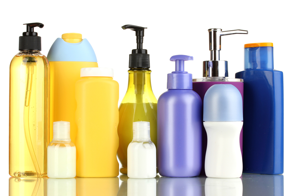 A line of hair care products in multi colored bottles